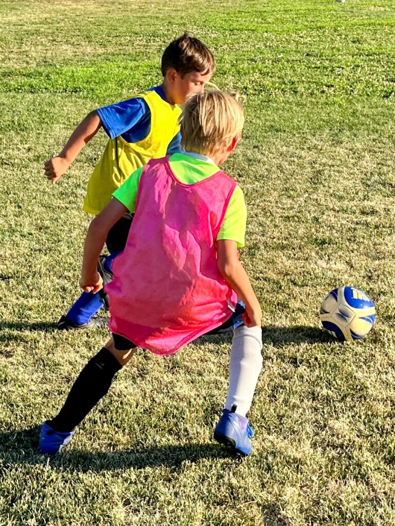 2 kids getting private soccer training lessons just like the ones you can find in Fresno, Clovis, Madera, and Kerman